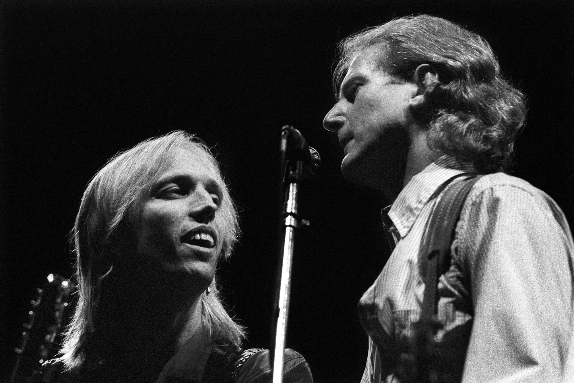Tom Petty and Roger McGuinn perform on stage with Bob Dylan at Ahoy, Rotterdam, Netherlands, 19th September 1987.
