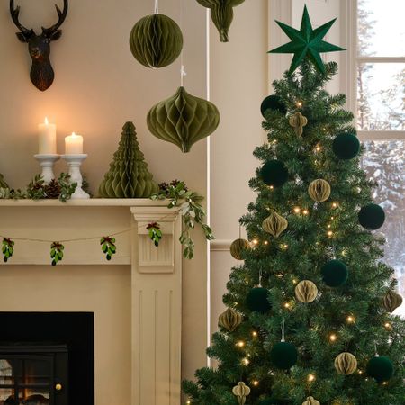 A Christmas-decorated living room with a Christmas tree