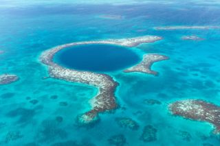 Aerial view of blue hole off the coast of belize
