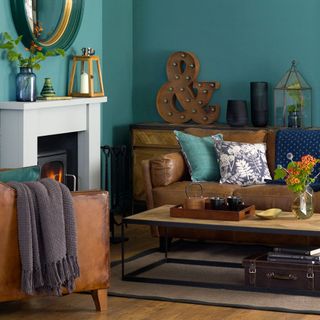 Green living room with leather sofas