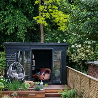 black shed at end of garden