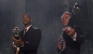 Men In Black Will Smith and Tommy Lee Jones aim their future guns at an alien
