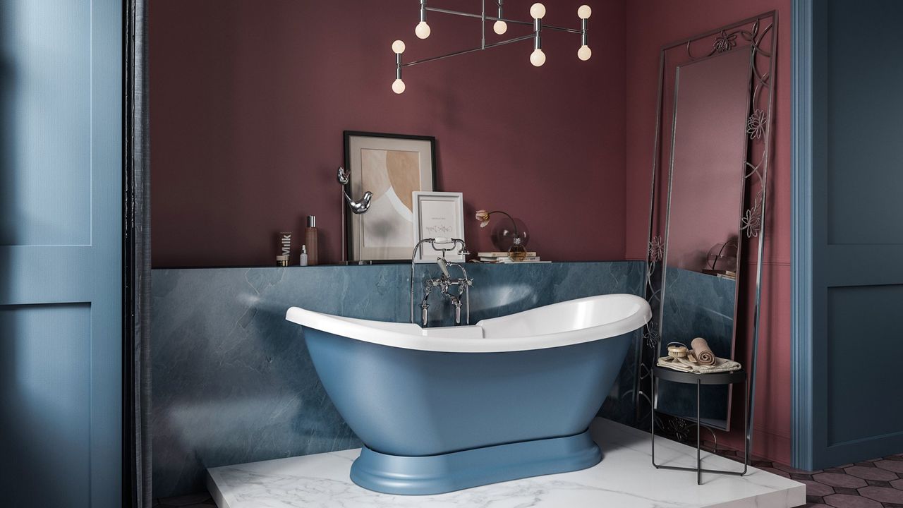 Blue bathroom ideas: Sky blue freestanding bathtub and berry red wall by Blue Sky Bathrooms