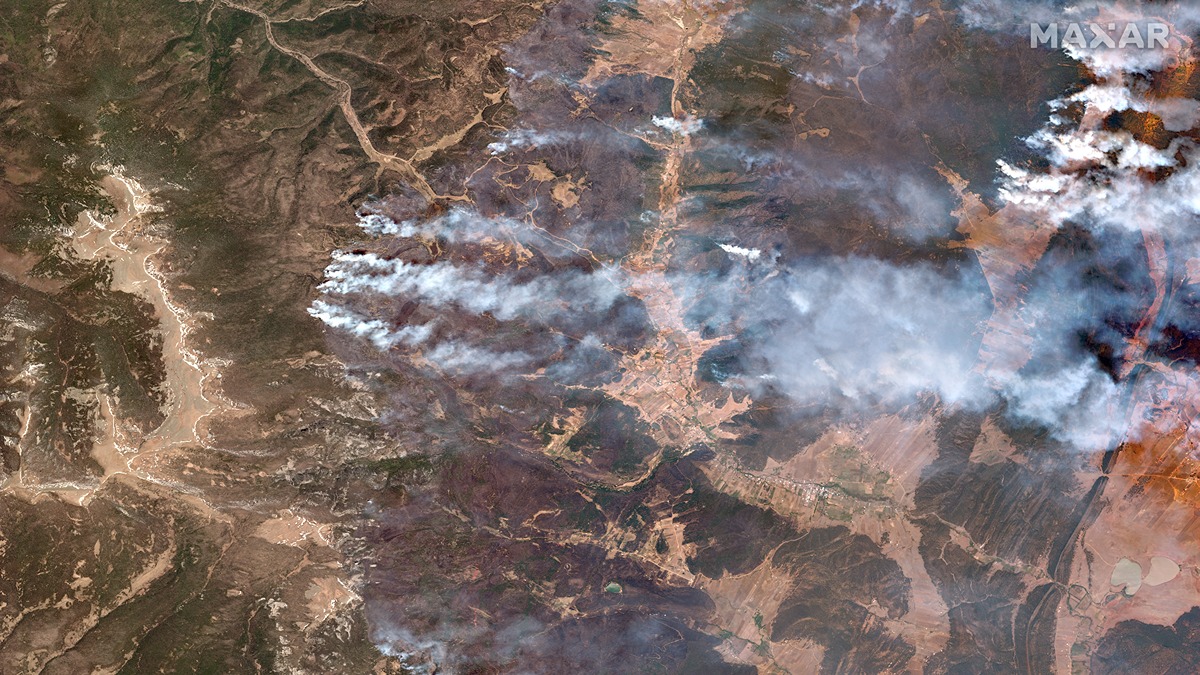 Tendrils of New Mexico wildfires are visible by satellite on May 11, 2022.