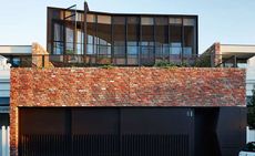 Red brick three-level townhouse in Melbourne is the brainchild of Australian architect Stephen Jolson