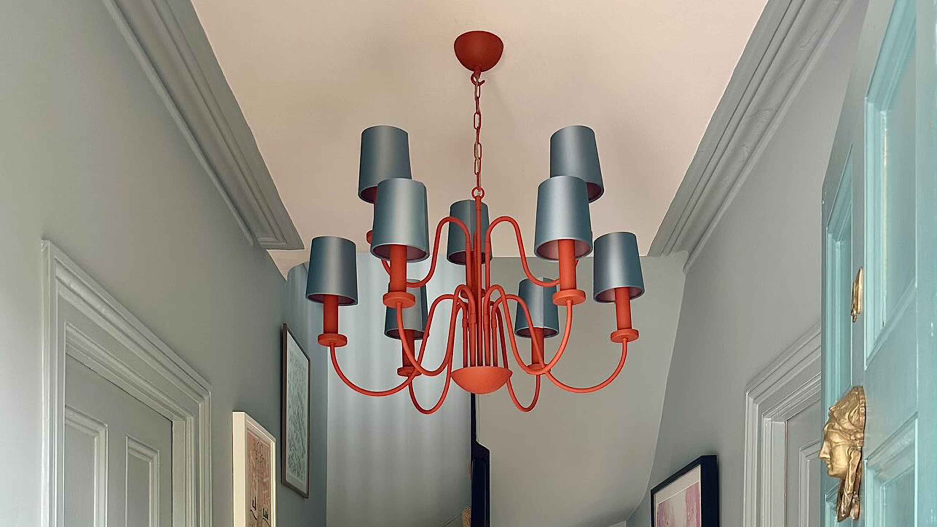 blue and red ceiling light in blue hallway