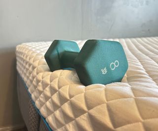 A weight on the side of the Simba Hybrid Pro Mattress.