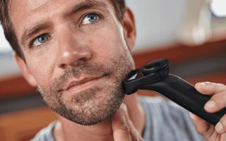 Man shaving his face
