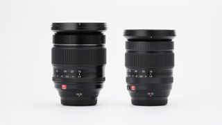 Fujifilm XF 16-55mm f/2.8 R LM WR II lens next to a Fujfilm XF 16-55mm f/2.8 R LM WR lens on a white background