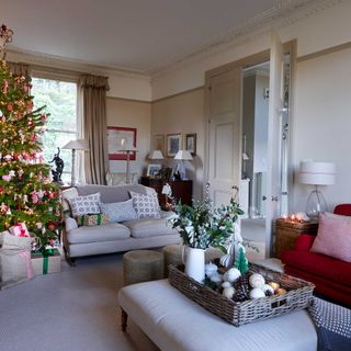 iving room with double doors decorated for christmas with red and white scheme