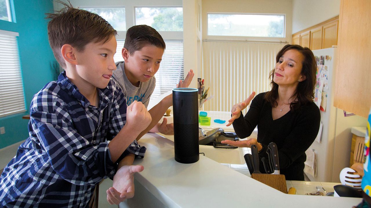 People getting excited by a smart speaker