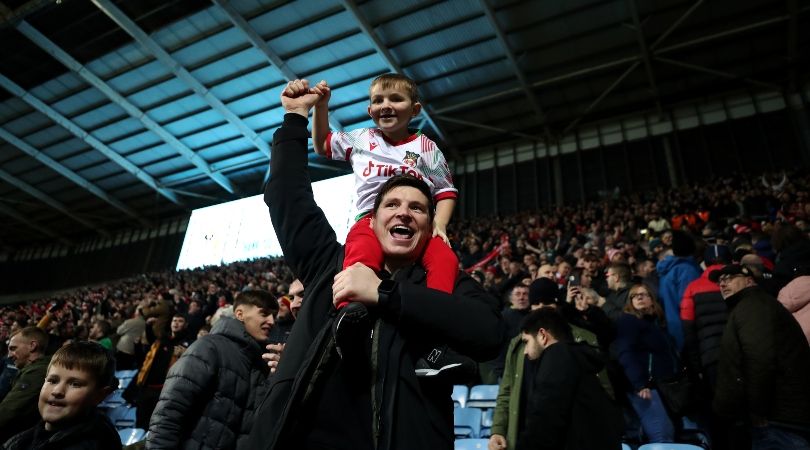 Wrexham fans celebrate during their team&#039;s 4-3 win over Coventry City in the FA Cup third round.