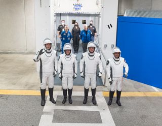 The astronauts of NASA's Crew-2 mission launching on a SpaceX spacecraft walk out of their crew quarters during a launch dress rehearsal on April 18, 2021 at NASA's Kennedy Space Center in Cape Canaveral, Florida. They are (l-r): Thomas Pesquet of the European Space Agency, Megan McArthur and Shane Kimbrough of NASA and Akihiko Hoshide of the Japan Aerospace Exploration Agency.