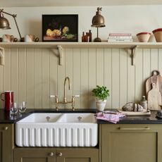 Olive green kitchen with wall panelling