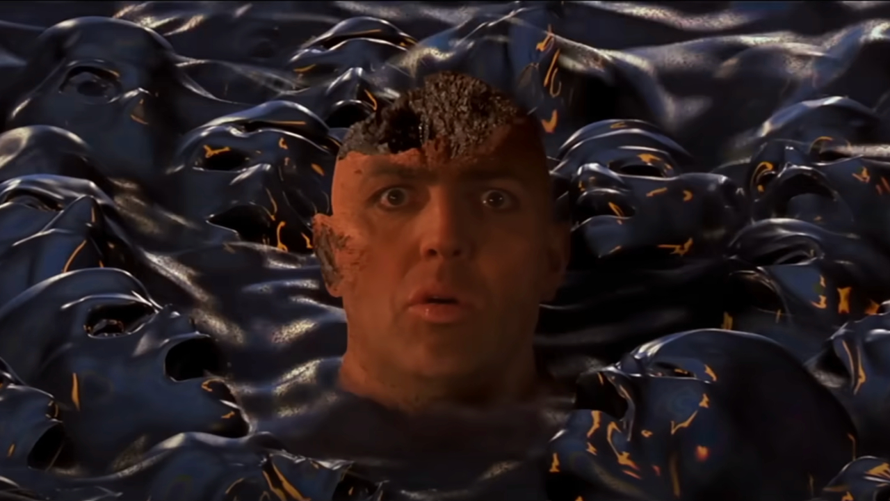 A frightened Arnold Vosloo surrounded by a pool of spirits in The Mummy.