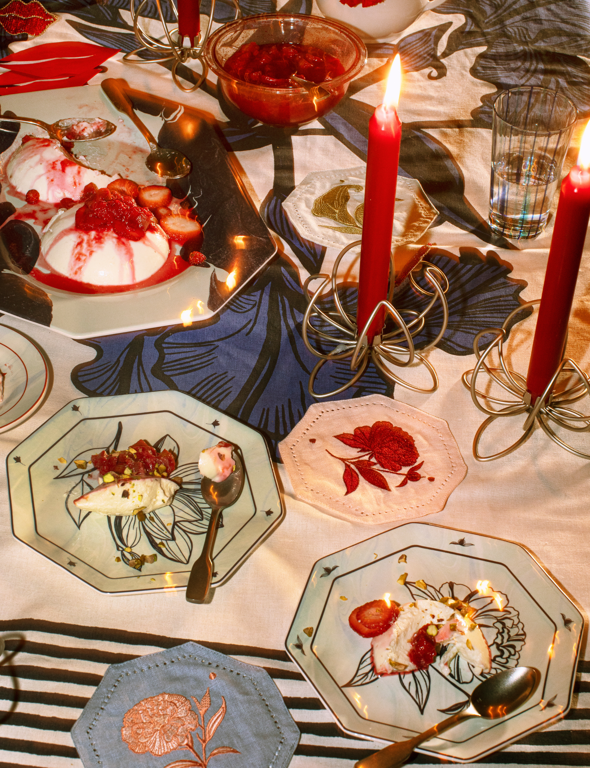 Maximalist table setting featuring octagonal plates and punchy floral table linens