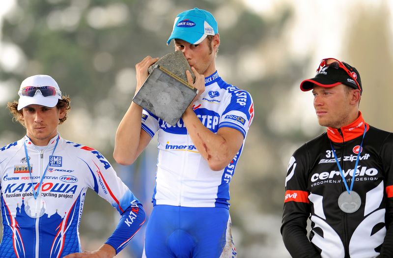 Tom Boonen celebrates going back-to-back in 2009 while Pippo Pozzato and Thor Hushovd's faces say it all