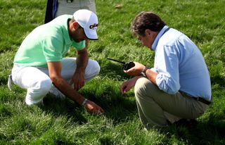 Alvaro Quiros identifying his ball