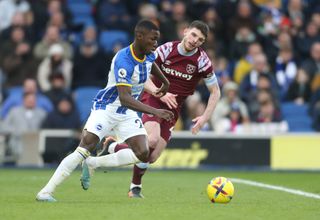 Brighton & Hove Albion's Moises Caicedo and West Ham United's Declan Rice during the Premier League match between Brighton & Hove Albion and West Ham United at American Express Community Stadium on March 4, 2023 in Brighton, United Kingdom.
