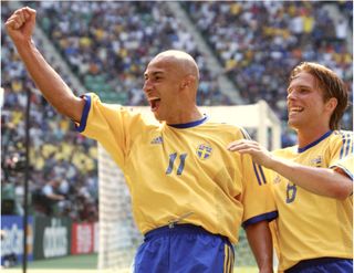 Henrik Larsson celebrates with a fist-pump after scoring for Sweden against Senegal at the 2002 World Cup