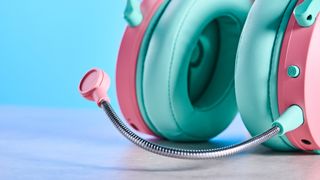 A pink and teal Cooler Master CH351 wireless gaming headset