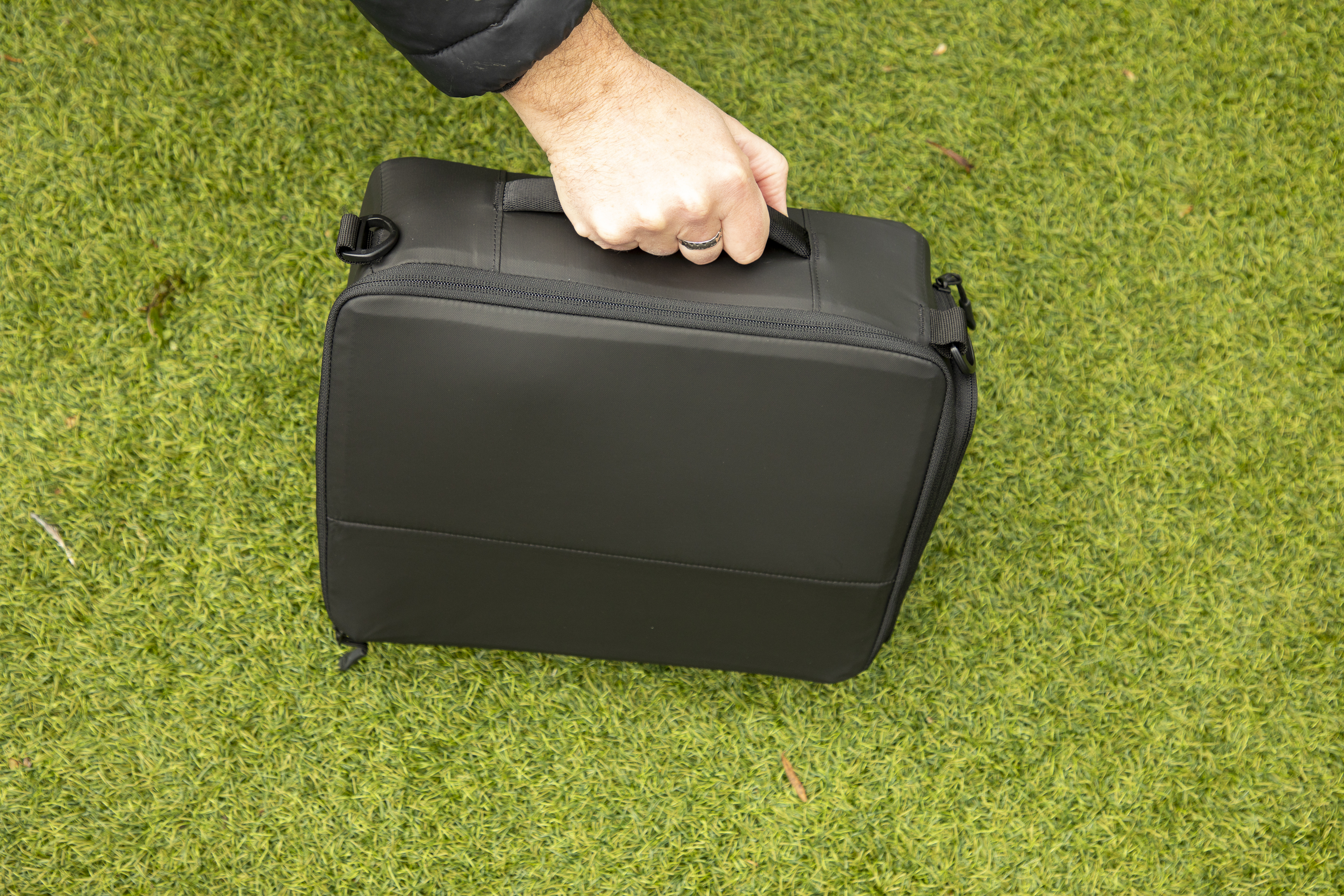 inside a camera backpack with internal dividers, being removed
