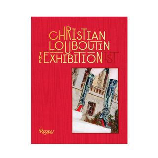A red book that says 'Christian Louboutin The Exhibitionist' with a picture of boots on it