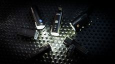 Best Bike Lights grouptest lead image by Cycling Weekly 2025. 6 bike lights all turned on facing each other in a circle.