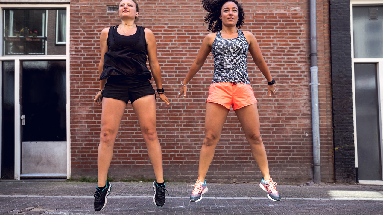 Two women jumping