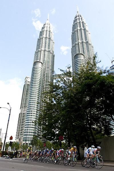 The peloton head past KL's Twin Towers during their city circuit loops on the final day.