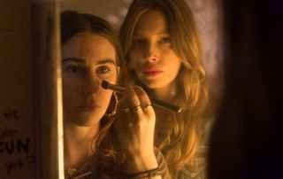 Scene from Bleeding Heart, Jessica Biel watching a woman apply makeup in the mirror