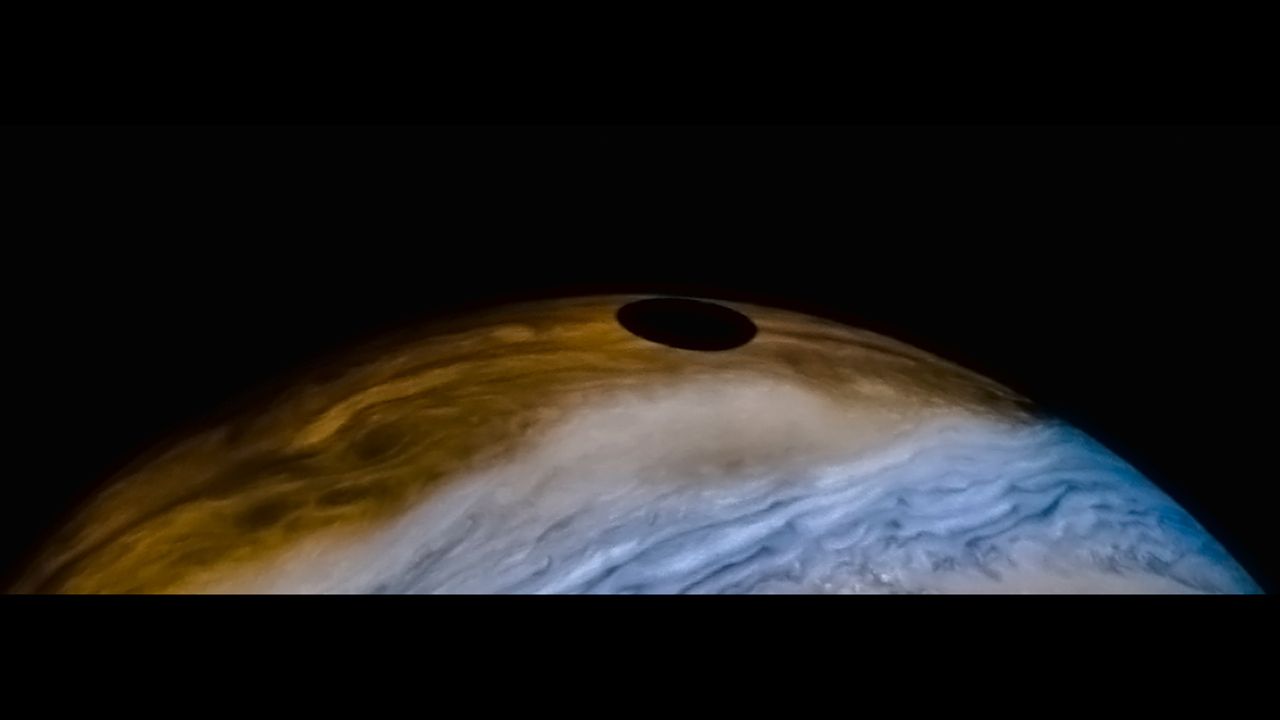 A view of Io's shadow on the surface of Jupiter captured by NASA's Juno probe.