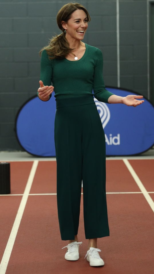 Catherine, Princess of Wales laughs after taking part in a short sprint race during a SportsAid Stars event at the London Stadium in Stratford on February 26, 2020