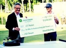 Who funds the prize money on the PGA Tour:cheque presentation to JT Poston winner of the John Deere Classic of 2022 GettyImages-1241745289