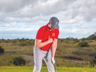 John Howells using the surfer hand signal to ensure the golf swing stays connected