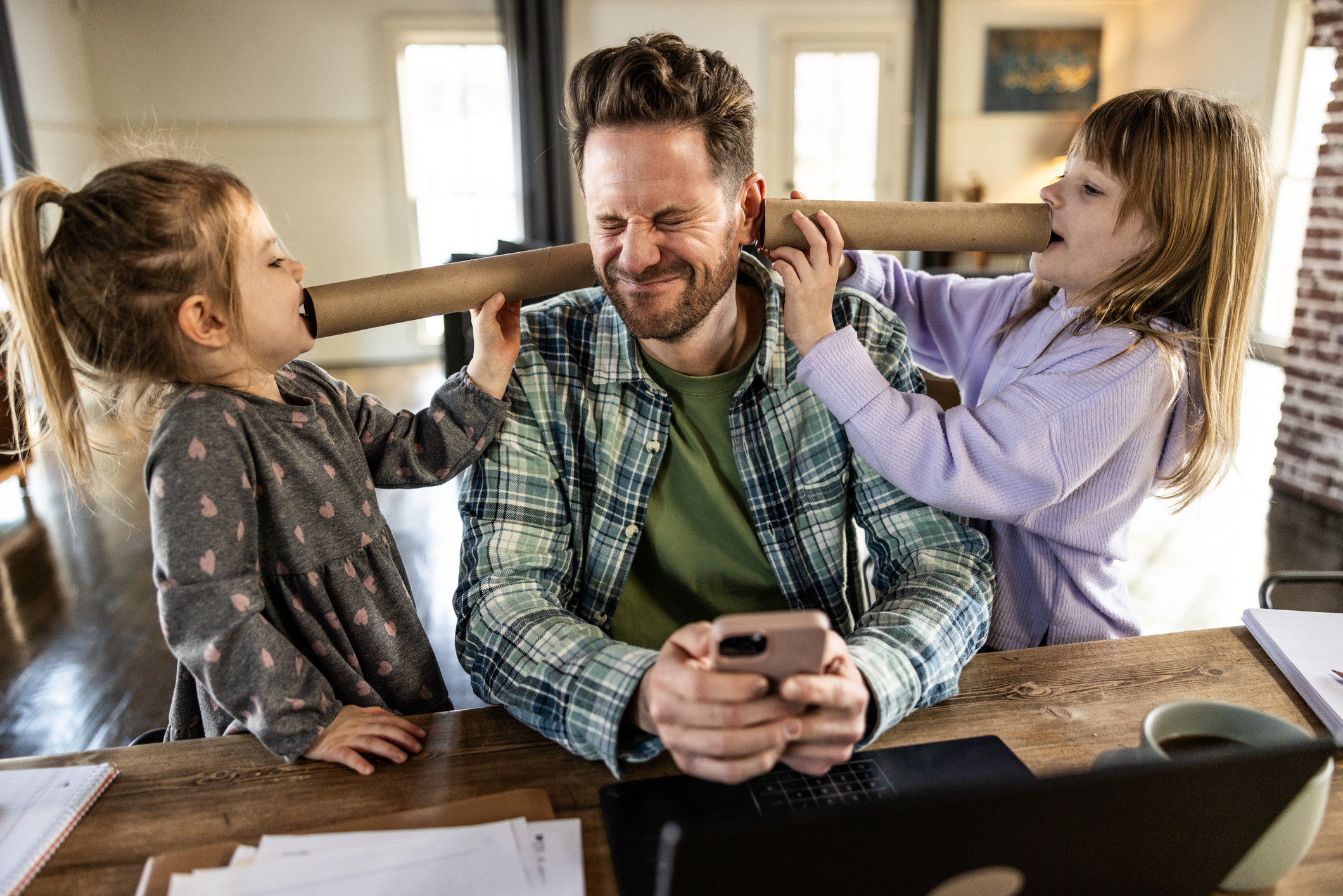 Dad trying to work from home while two young daughters are yelling in his ears.