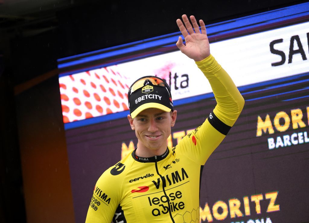 Stage winner Team Visma&#039;s British rider James Matthew Brennan celebrates with the yellow jersey on the podium of the first stage of the 2025 Volta a Catalonya cycling tour of Catalonya, a 178,3 km loop starting and finishing in Sant Feliu de Guixols, on March 24, 2025. (Photo by Josep LAGO / AFP)