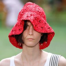 a model wearing a crochet hat