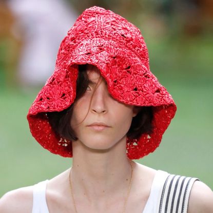 a model wearing a crochet hat