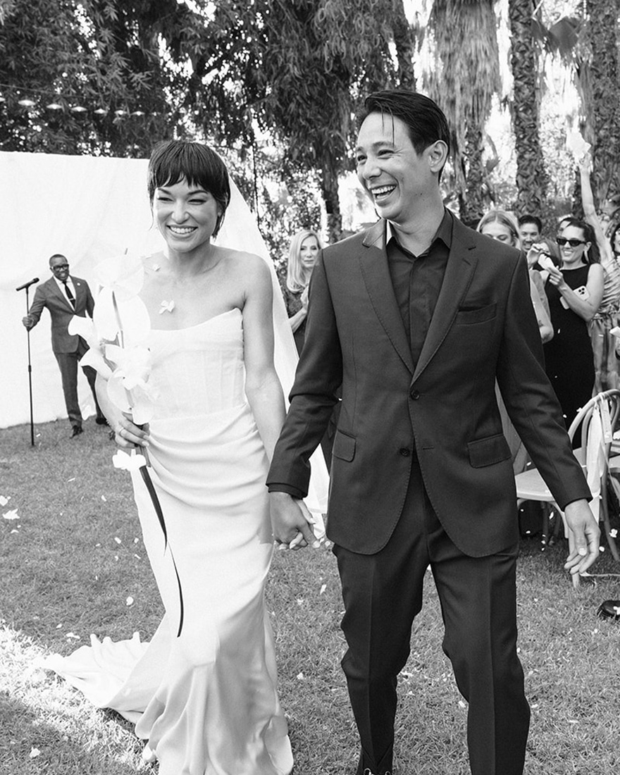 Britni and Sean holding hands.