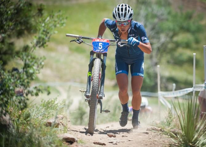 Evelyn Dong (Backcountry.com) finds running up the climb is more efficient than riding during the elite women's cross country race.