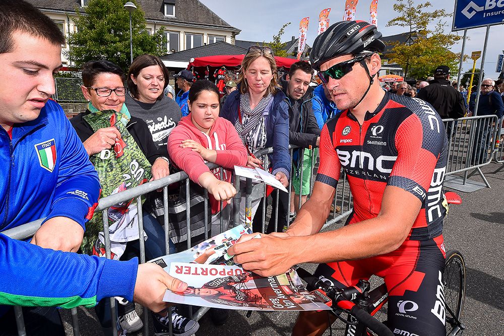 Greg Van Avermaet signs an autograph before the final stage.