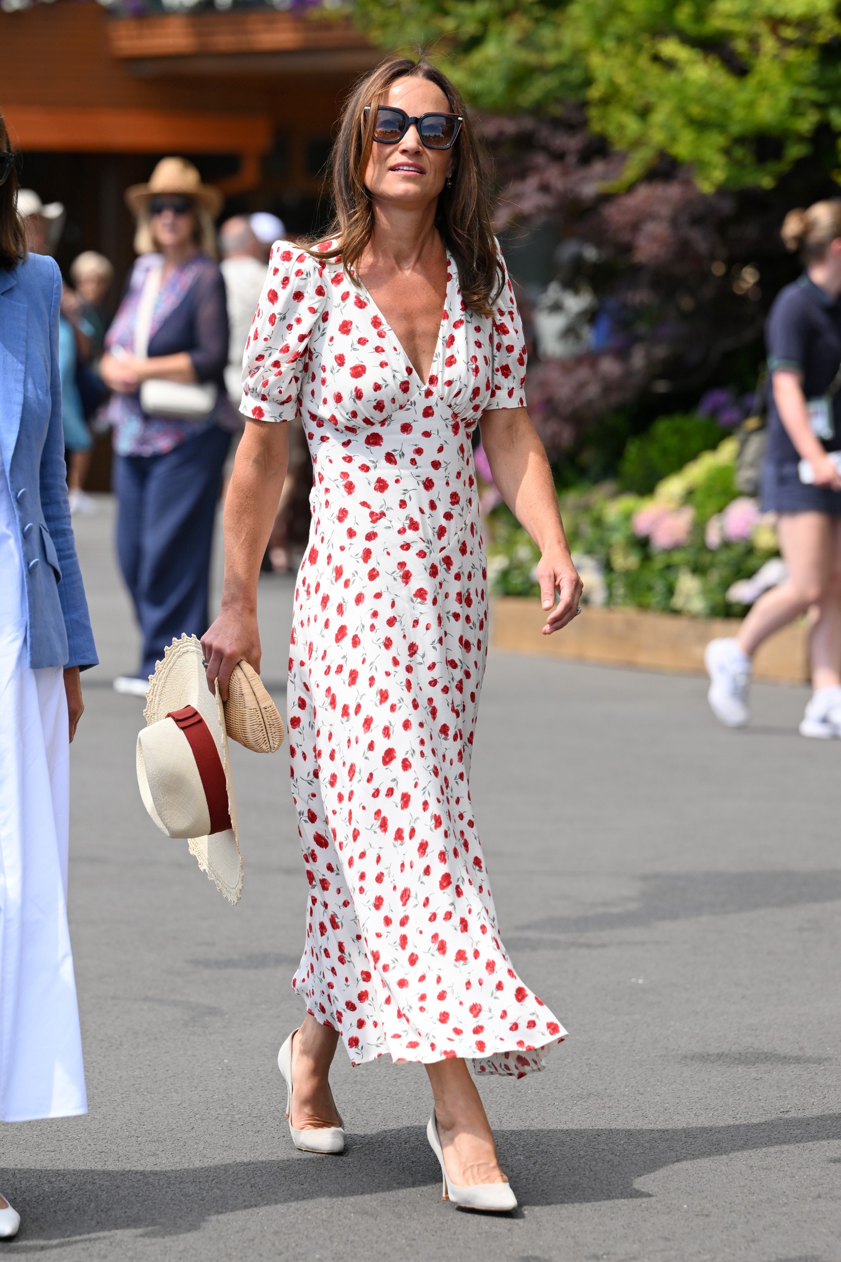 Pippa Middleton wearing a white dress and holding a hat at Wimbledon 2026