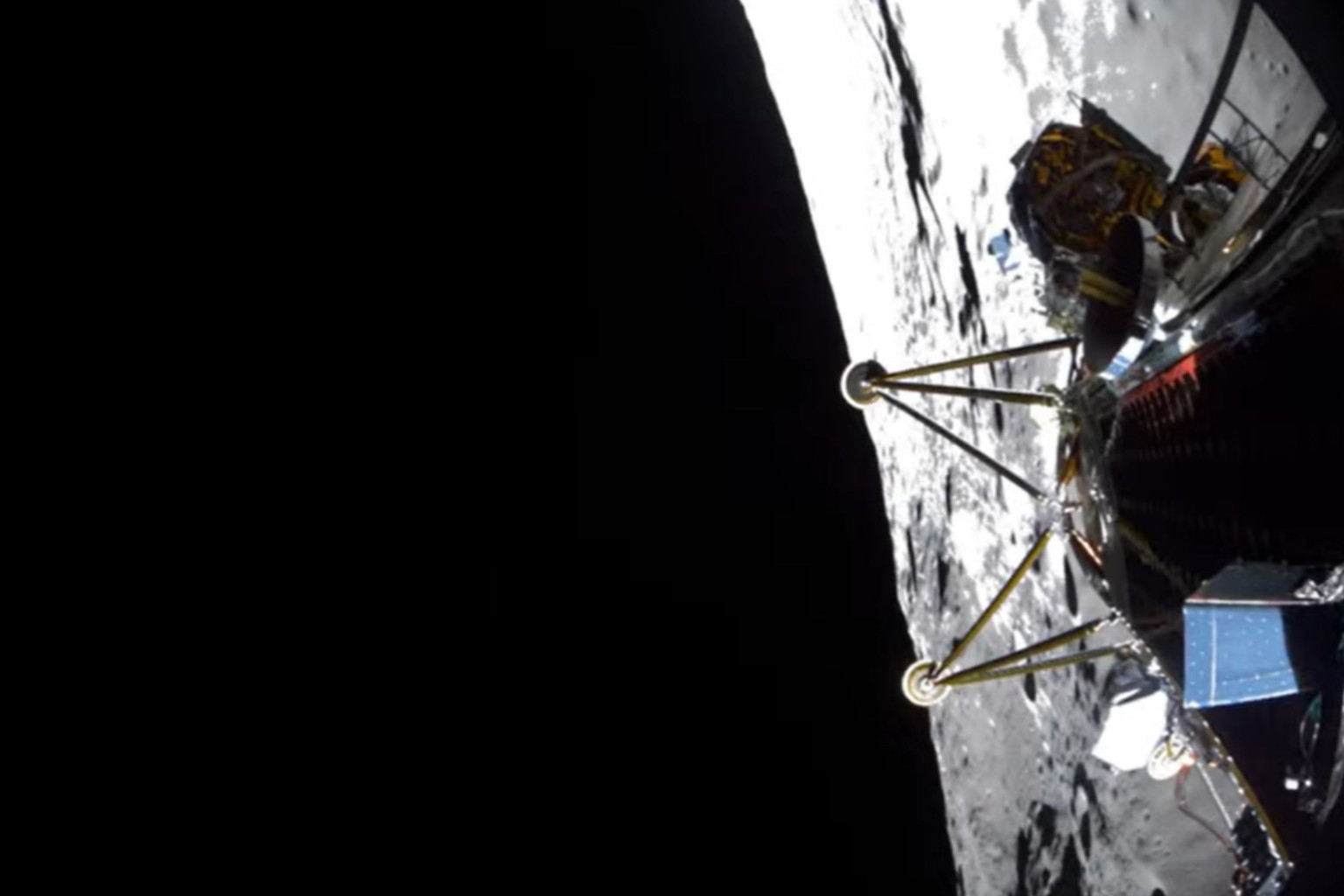 A view of the moon with the legs of a landing spacecraft and its body at right