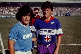 Diego Maradona poses alongside Daniel Passarella ahead of a Serie A game between Napoli and Fiorentina in May 1985.