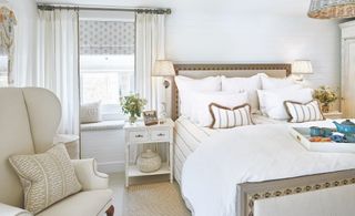 coastal cottage bedroom with white and taupe decor