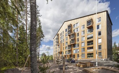 A view of a building outside with trees