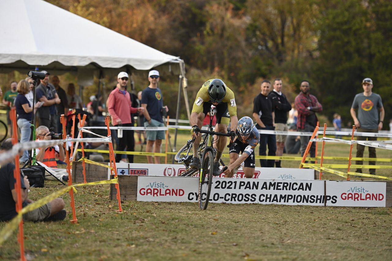 Scott McGill rides clean over the barriers while Lance Haidet stumbles