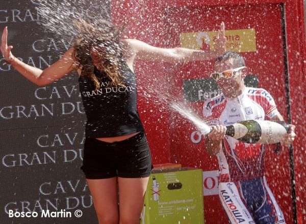 Joaquim Rodriguez lets the champagne fly.
