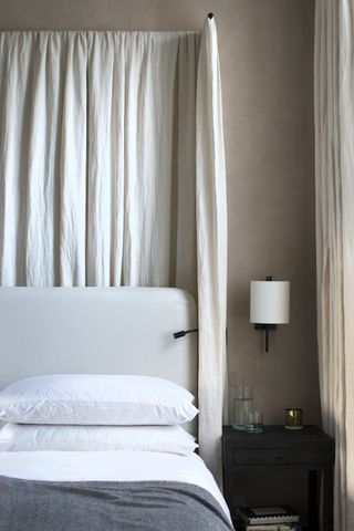bedroom by TR Studios with bed canopy by Riley Brooks